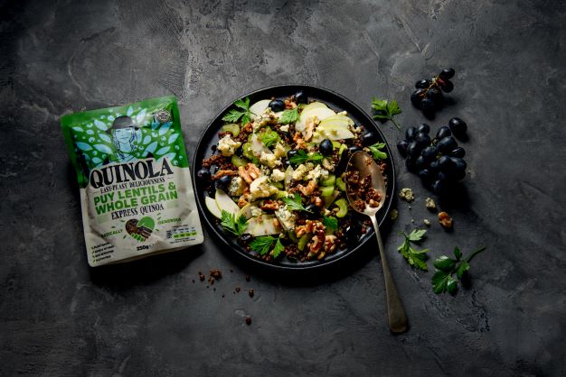 plate of quinoa, lentils apple and blue cheese salad with a pouch of quinola quinoa and lentils