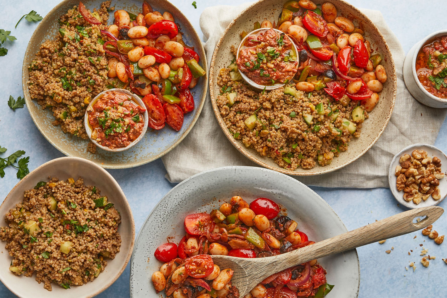 Bowl of golden quinoa and turkish style beans and tomatoes