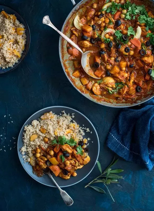 Chicken tagine next to quinoa