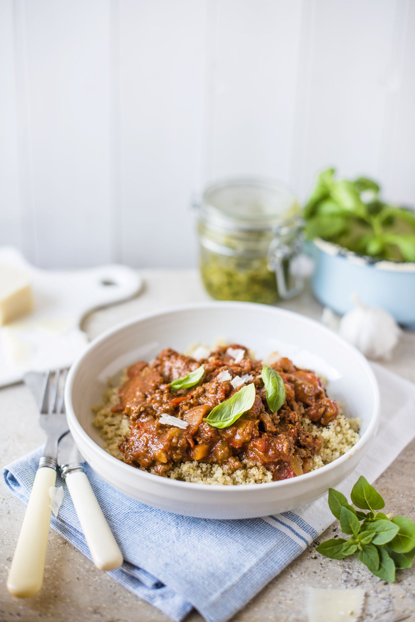 Bowl of quinoa topped with bolognese