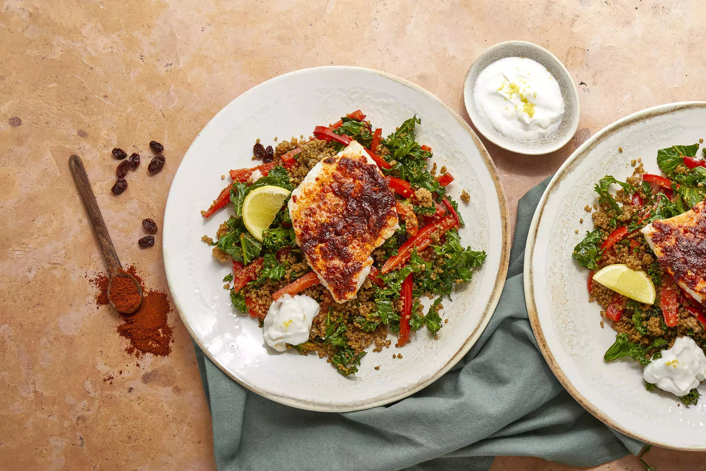 Plate of quinoa with a spiced cod and yoghurt