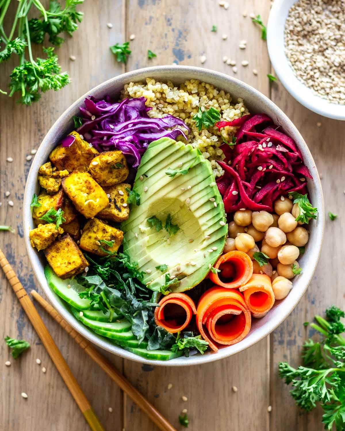 Bowl of vegetables with quinoa on the side