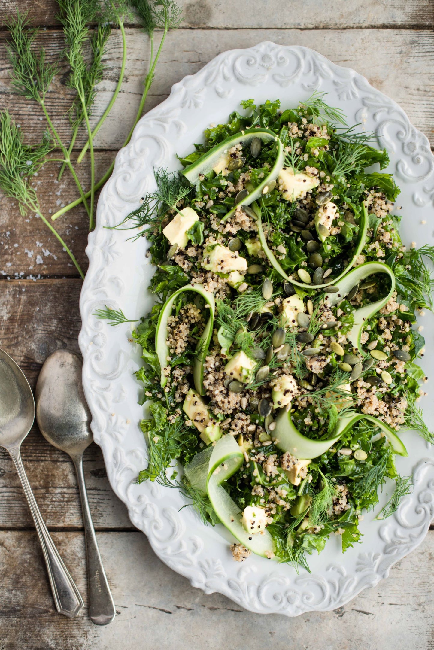 large salad plate of quinoa and green salad