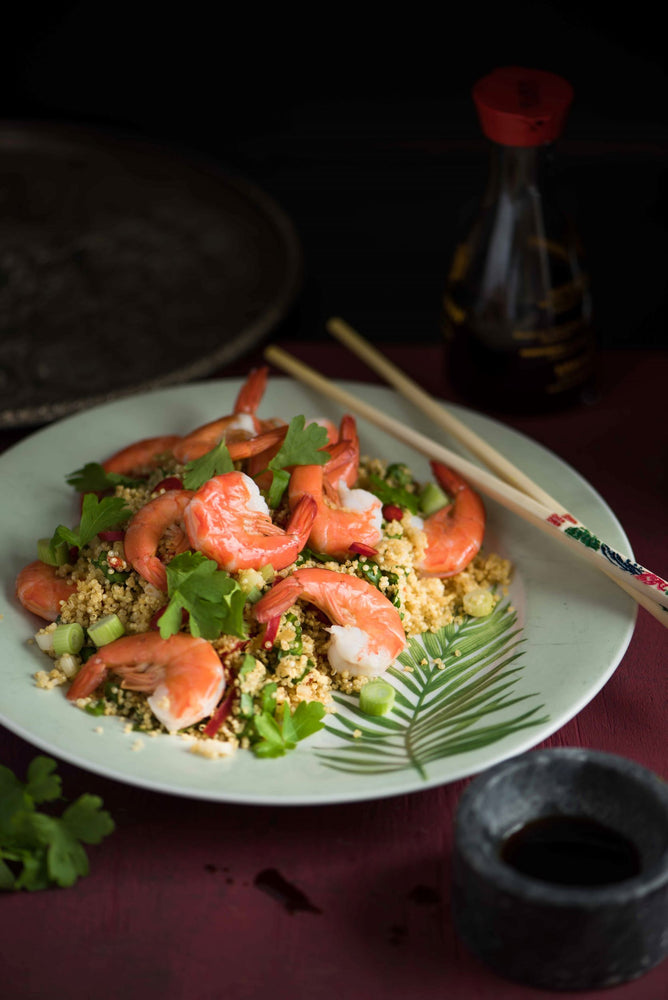 Plate of egg fried quinoa with prawns and spring onion 
