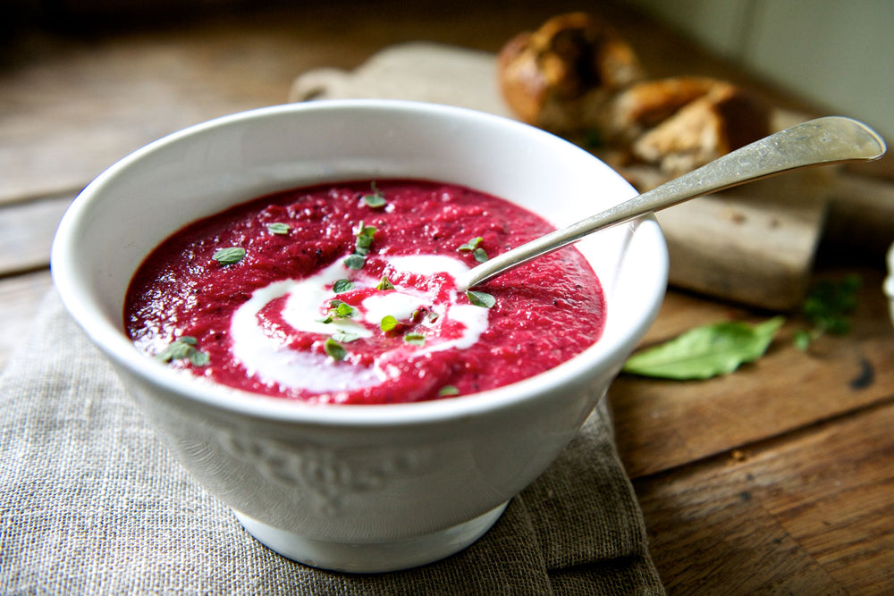 Bowl of pink beetroot and quinoa soup 