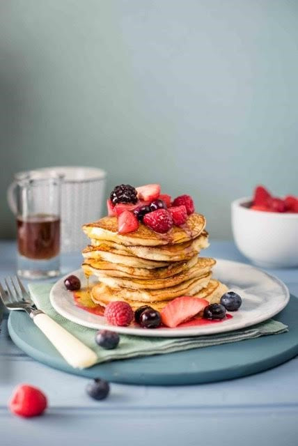 stack of quinoa pancakes with berries
